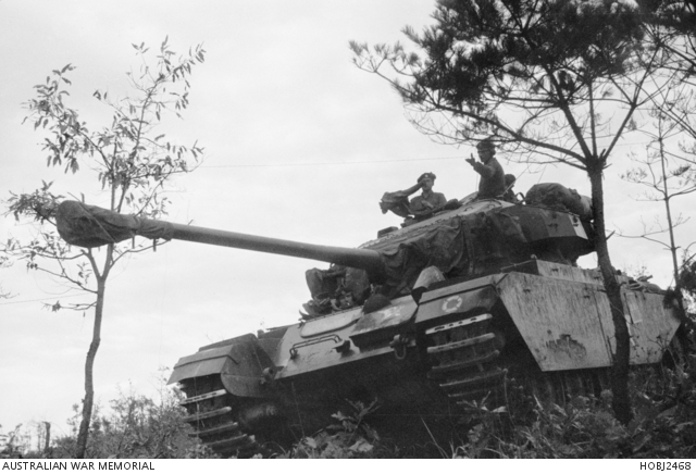 Old image of a Centurion tank going through trees