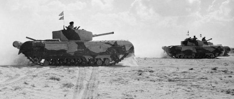 WWII Churchill III tankss in the desert